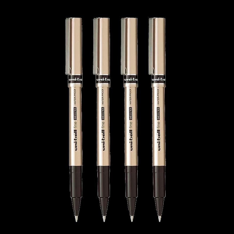 Four uni-ball Deluxe fine rollerball pens with brushed gold barrels.